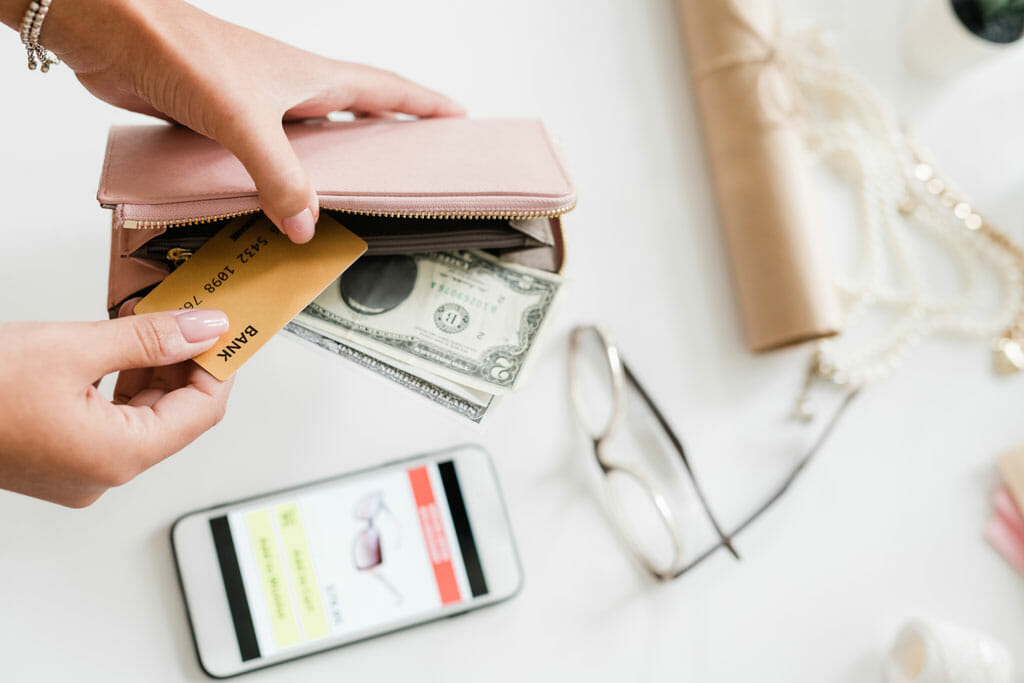 Young Woman Holding Nude Beige Leather Wallet